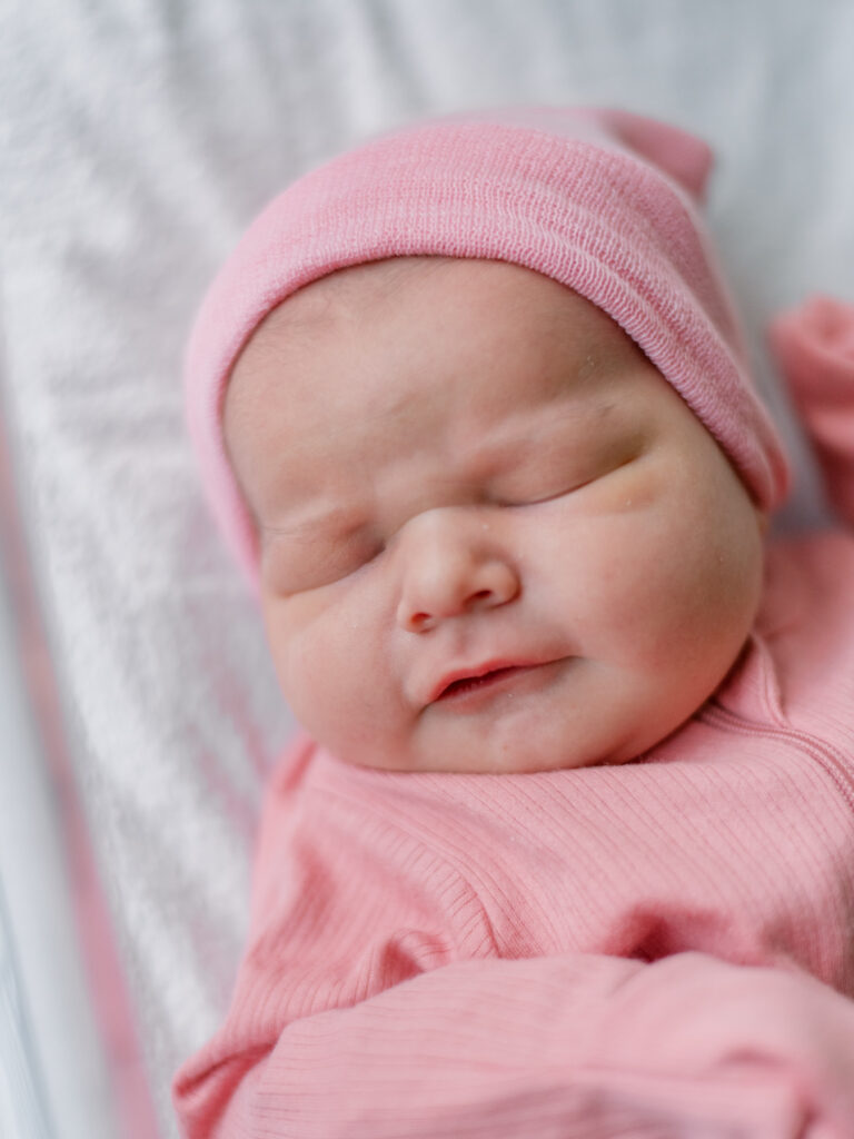 Newborn baby girl laying during Southern Maryland Birth photo session.