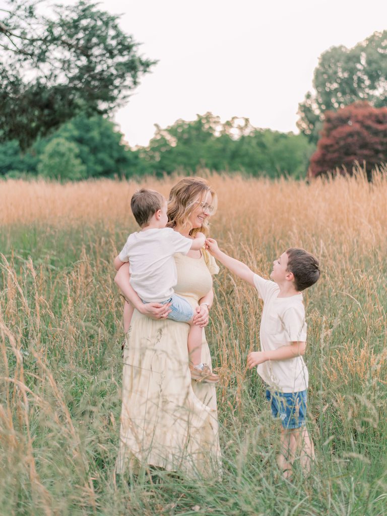 Mom and two boys having fun during their Virginia fall photo session
