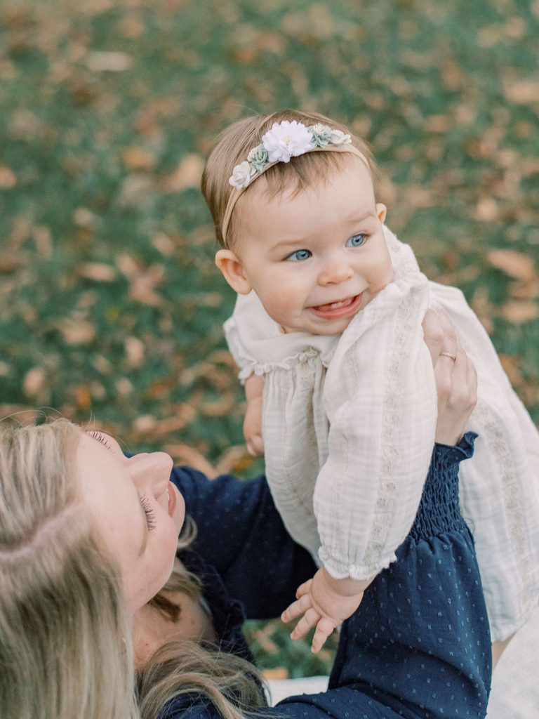 Mom and daughter dressed in beautiful outfits for their Fredericksburg Fall family portraits.