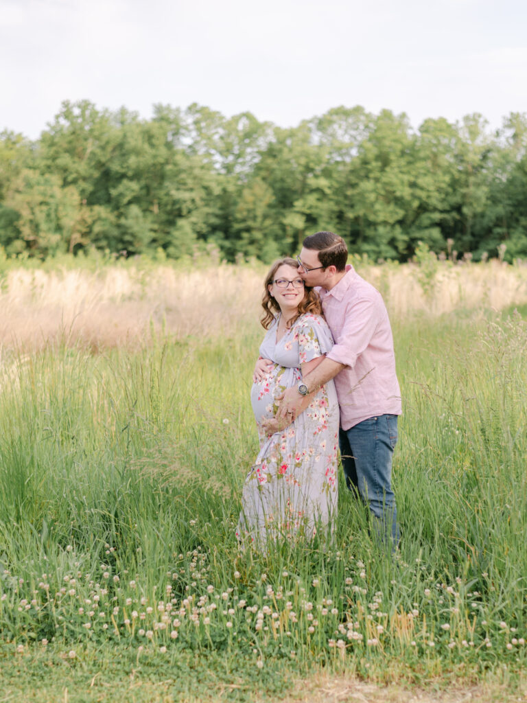 Newly expecting parents embracing each other during their Maryland Maternity session.