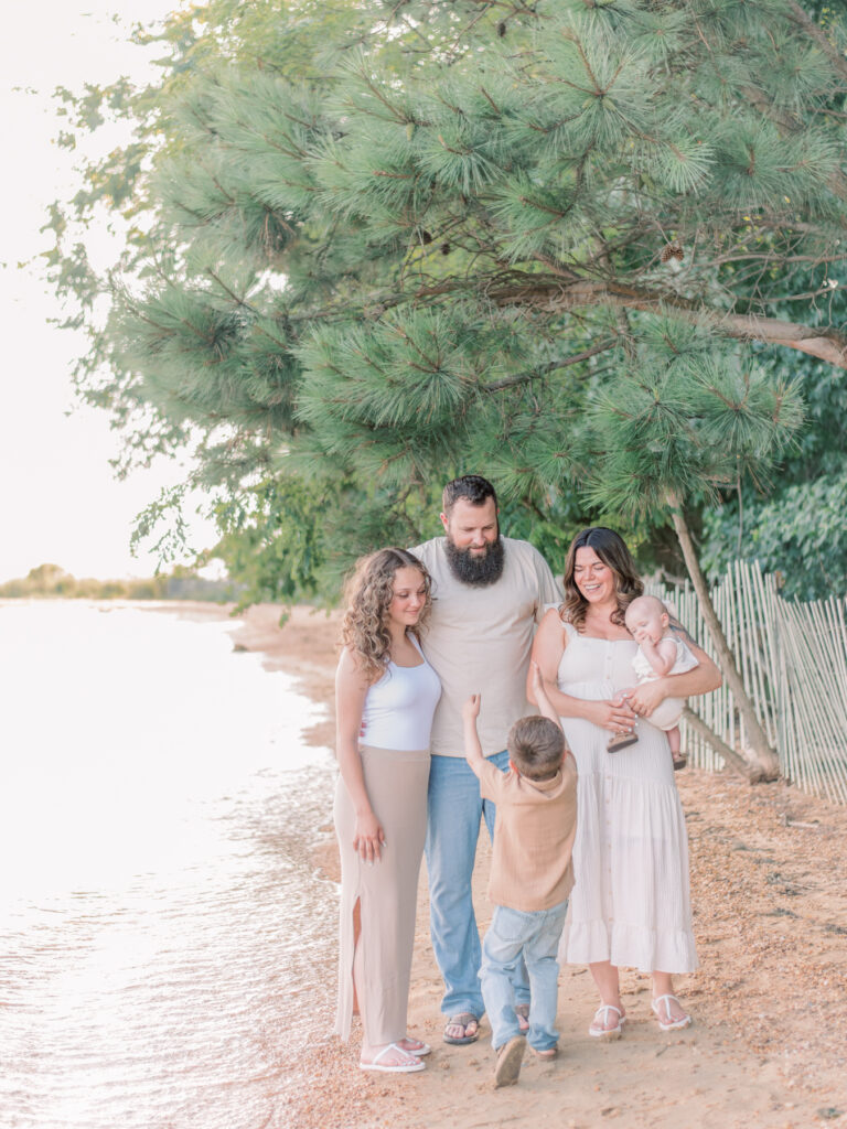 A family of five on beach at Newtowne Neck State Park with Southern Maryland Photographer.