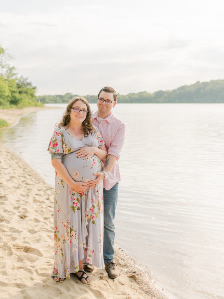 Couple expecting their first baby in Port Tobacco field. 