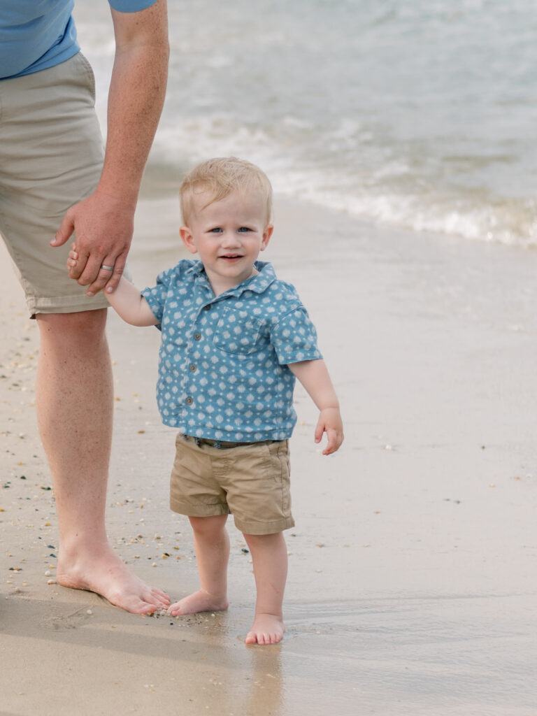 Little boy holding dads hand during full session in Richmond Virginia.