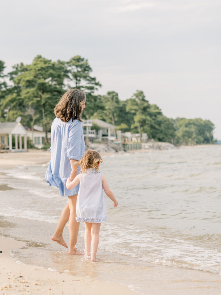 Mom and daughter holding hands during family portrait session in Richmond Virginia.